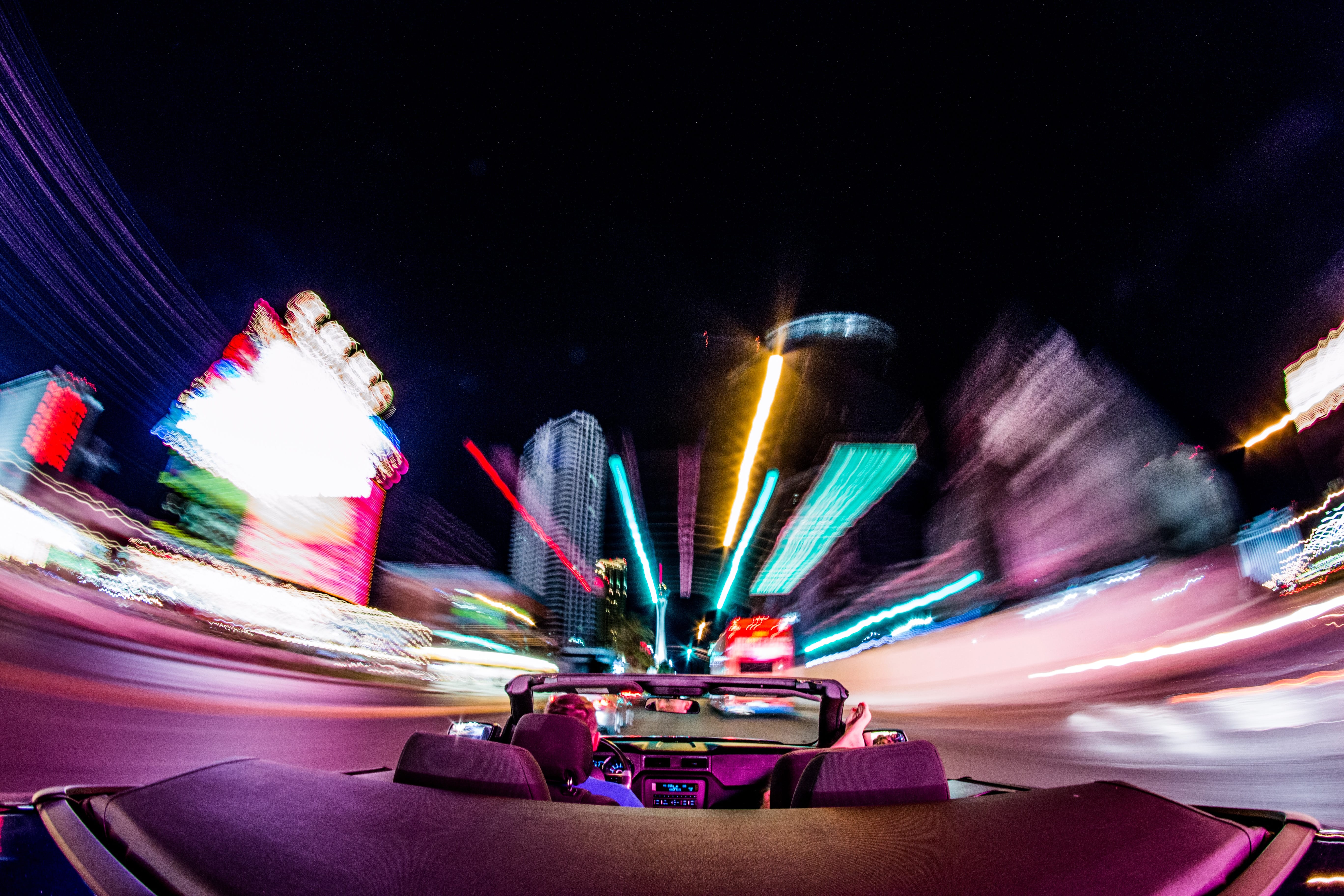 Timelapse photograph of driving in Las Vegas at night; image by Jakub Gorajek, via Unsplash.com.